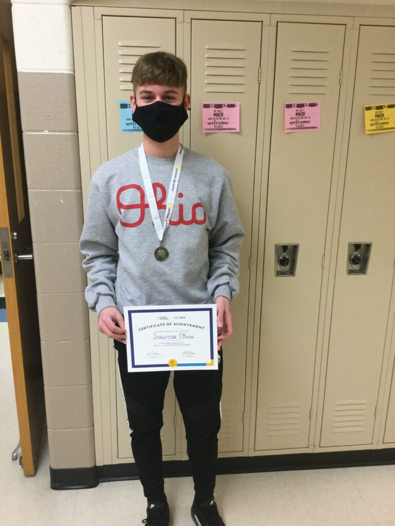 Boy standing in front of lockers