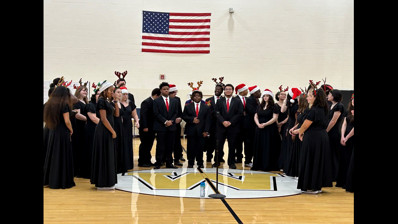 The Warren G. Harding Madrigals sing for students at Lincoln