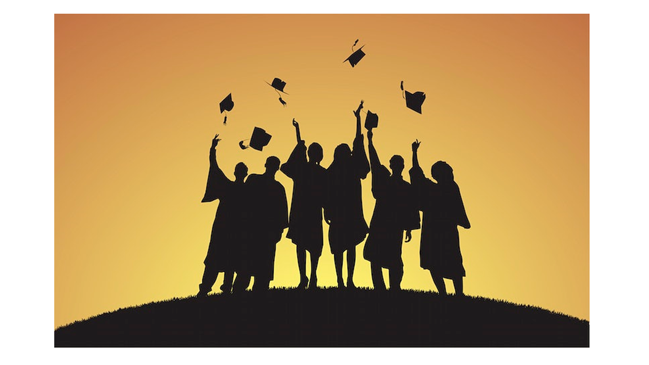 students throwing up caps for graduation