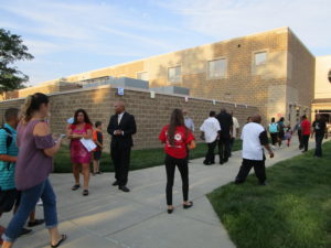 Men of Warren greeting our students on the first day of school.