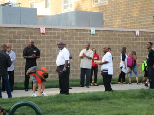 Men of Warren greeting our students on the first day of school.