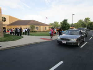 Men of Warren greeting our students on the first day of school.