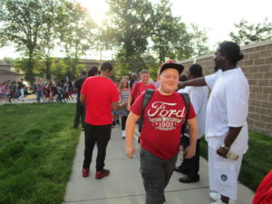 Men of Warren greeting our students on the first day of school.