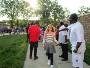 Men of Warren greeting our students on the first day of school.