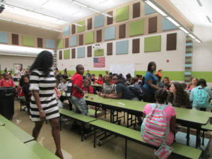 Mrs. Marciano greeting the students in the cafeteria.