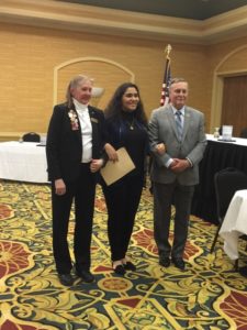 Gianna Jones posses with members of VFW and Auxiliary Post 1090.