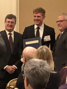 Cullen receives his award.