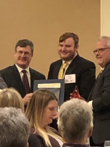 Xavier receives his award.