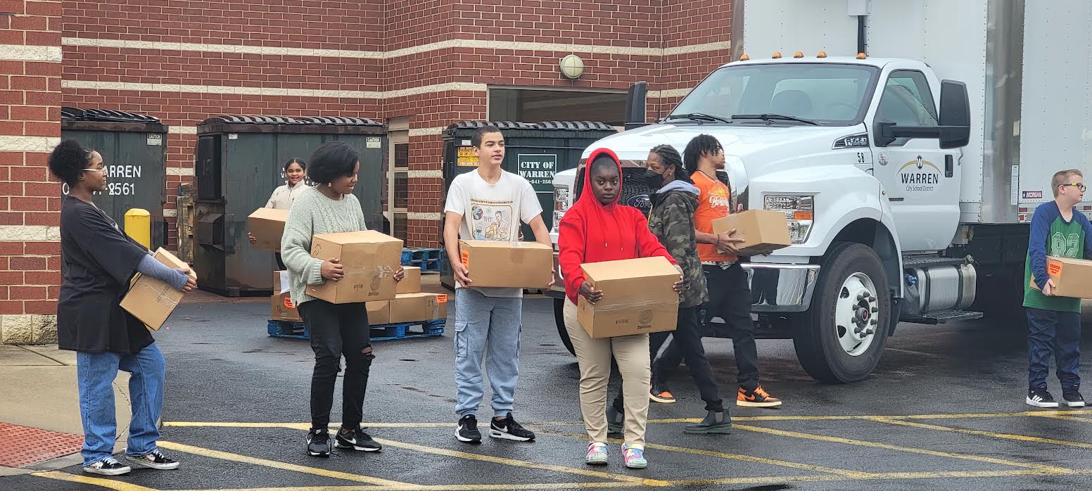 Lincoln Student Council & National Junior Honor Society help Second Harvest distribute goods & grace to families in need