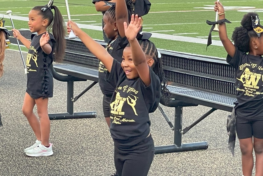 A Jefferson student is all smiles as she performs at band night.
