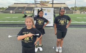 Three Jefferson students who performed at band night.