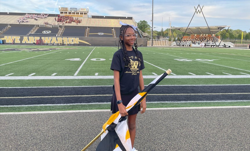 A Jefferson student performs with the flag line.