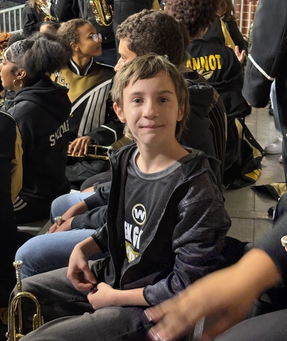 8th grader ready to enjoy the game.