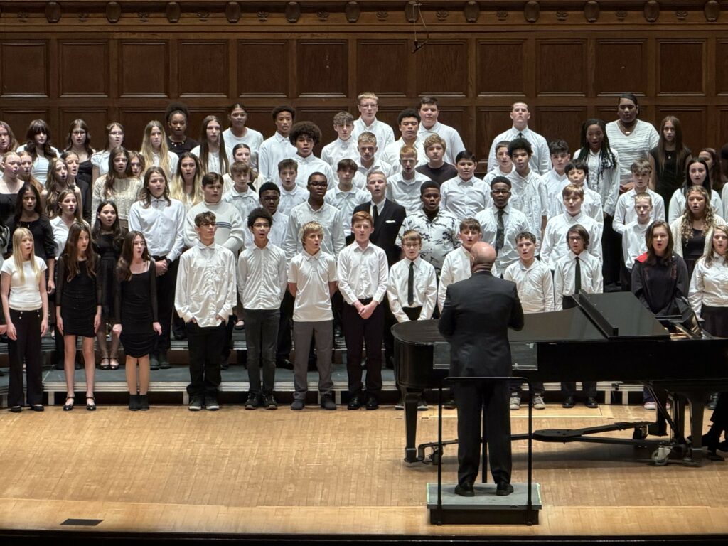 Students performing with others from various schools.