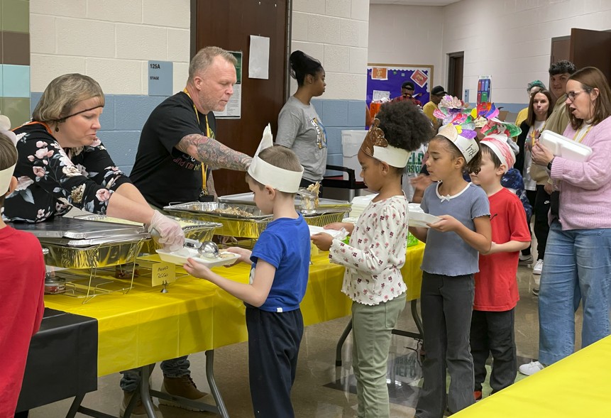 Students getting their Thanksgiving feast.