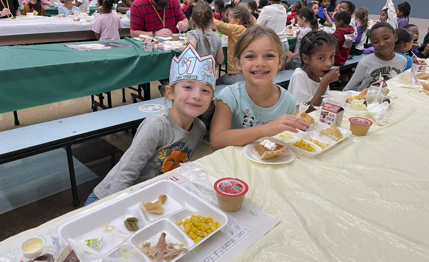 First graders having their lunch together.