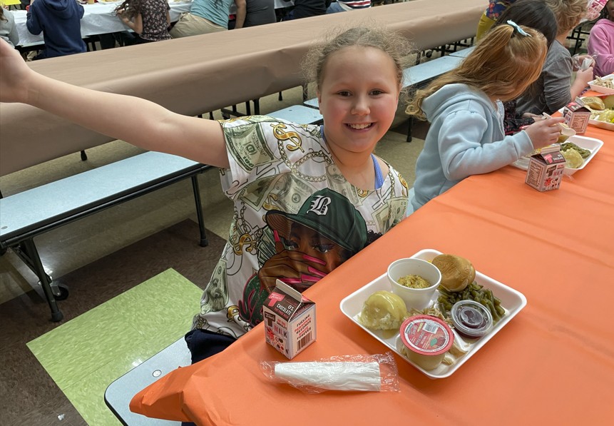 A student ready to enjoy lunch.
