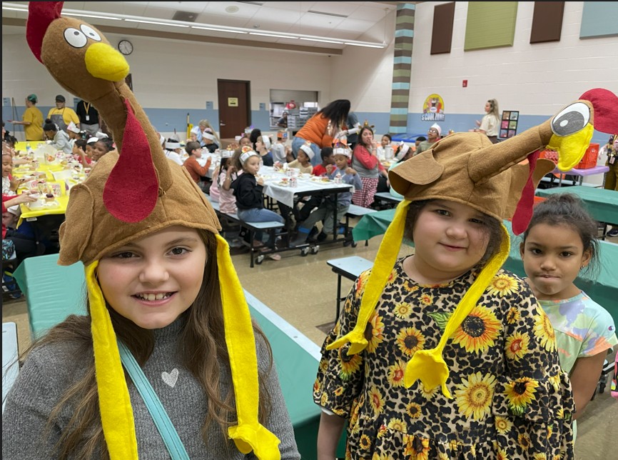 Third graders wearing their turkey hats.