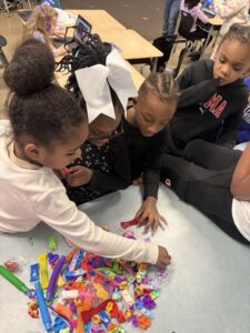 first grade students choose a fidget toy.