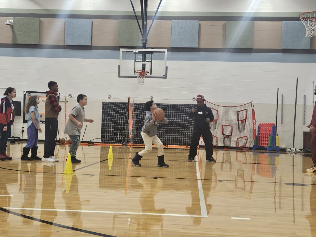Students practicing basketball skills