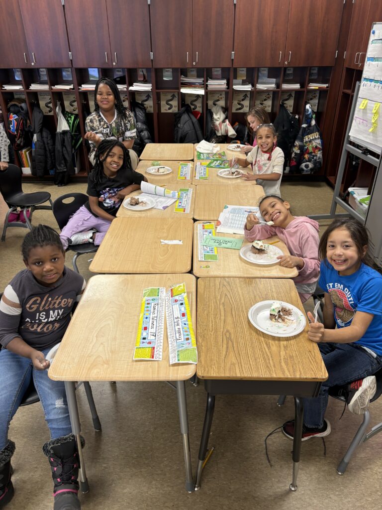 students enjoying their cake