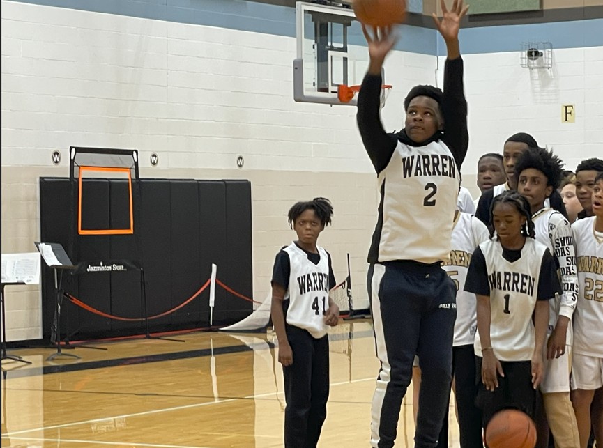 An seventh grade player shoots a free throw