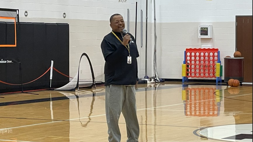Coach talks to the students