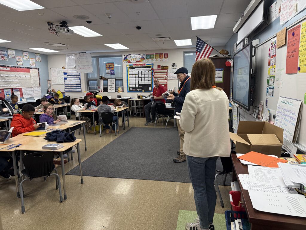 Students in Mr. Seidel's third grade class listen to a representative from the Rotary speak.