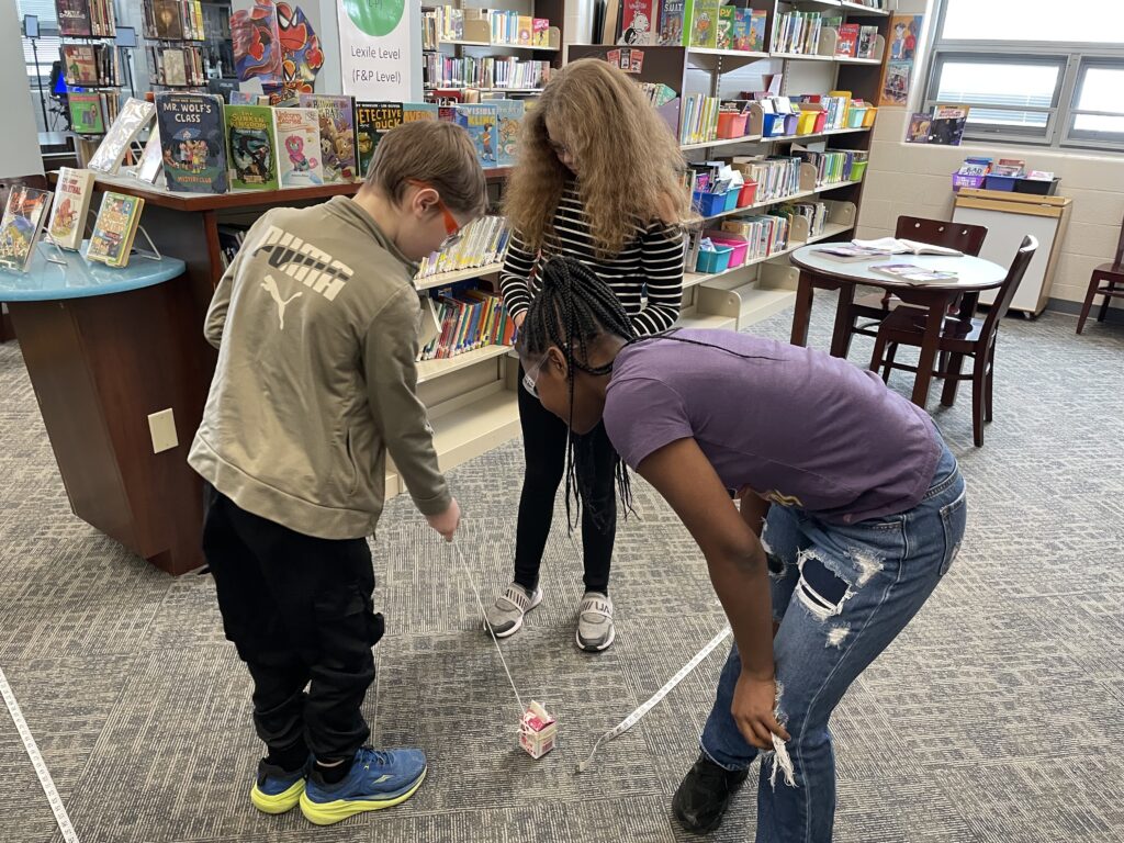 Students work together on the experiment