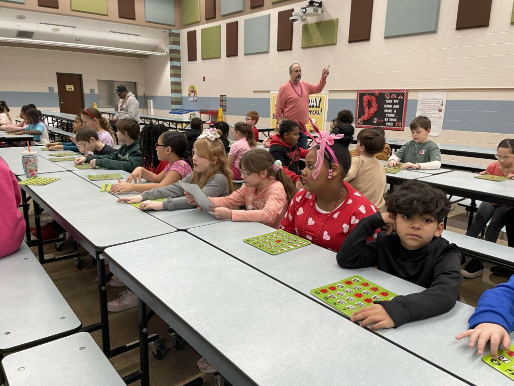 Mr. Seidel helps call out numbers and letters for bingo