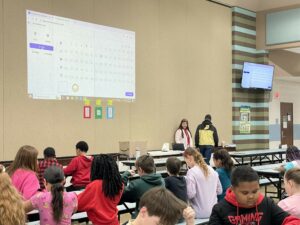 Students listen closely to letters and numbers being called