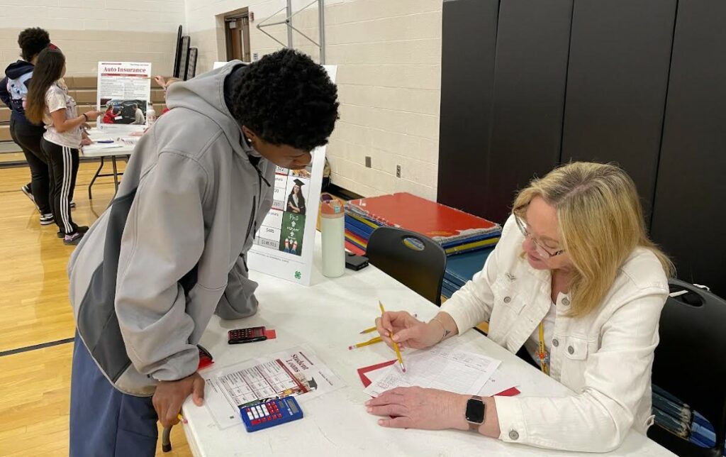 Student listens to information about budgeting for student loans