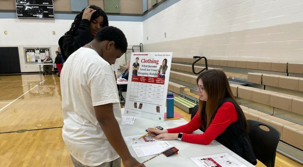 Students manage money for clothing