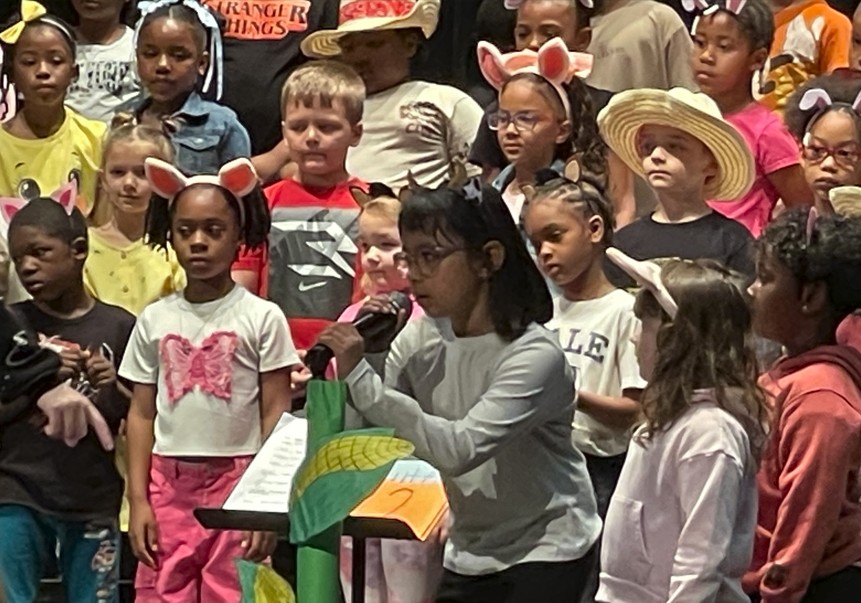 A student recites her lines perfectly