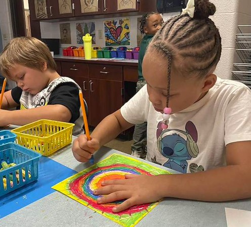 students working with oil pastels