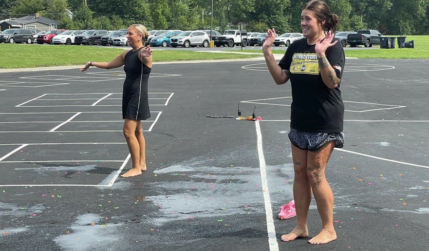 Ms. Prater and Mrs. Tamburro get water balloons thrown at them