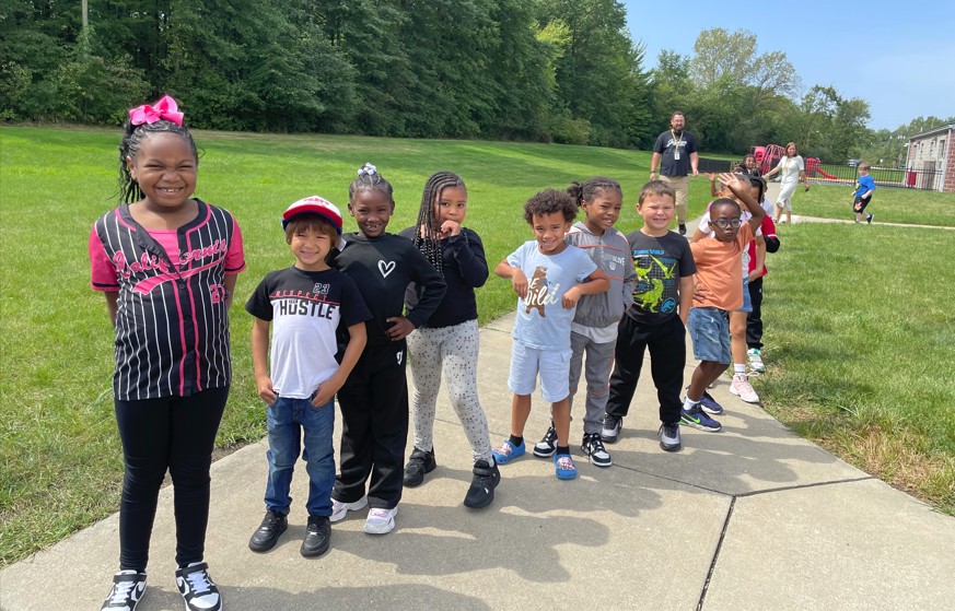 Students line up outside, ready to throw their water balloons