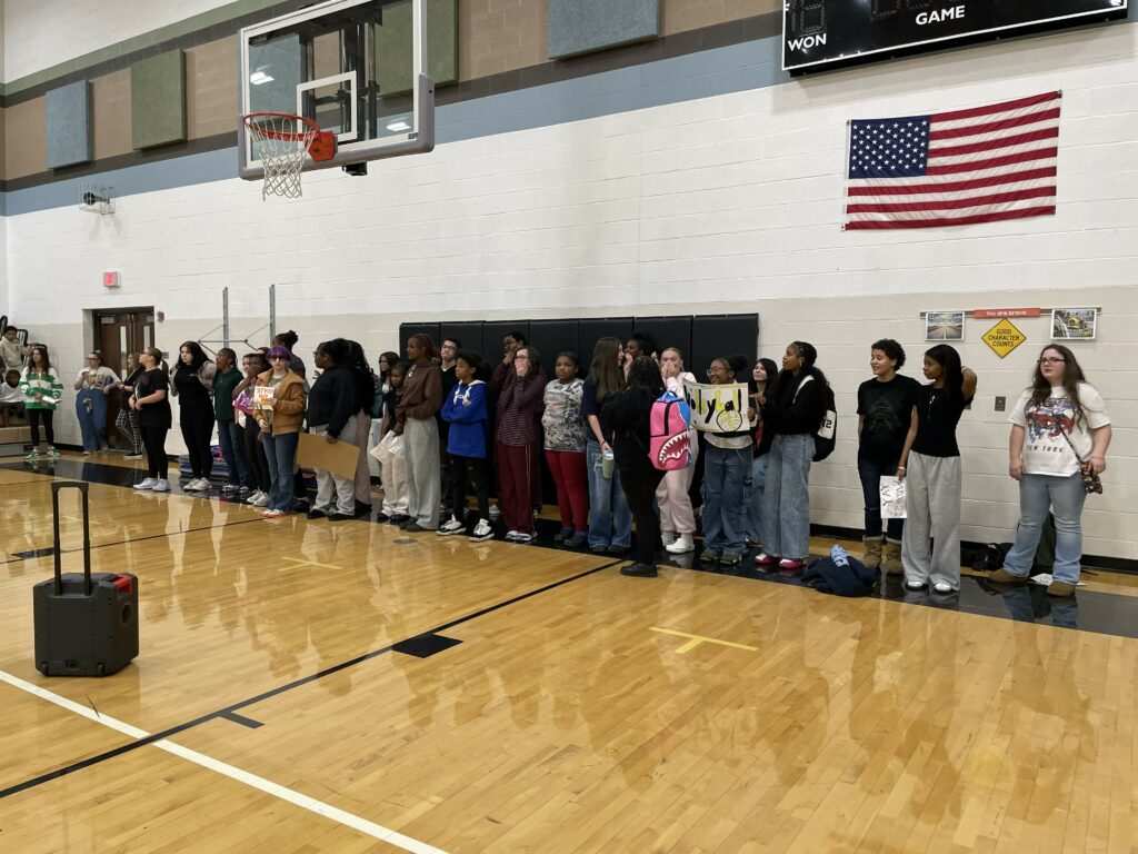 Jefferson choir members open the pep rally with a performance of the National Anthem