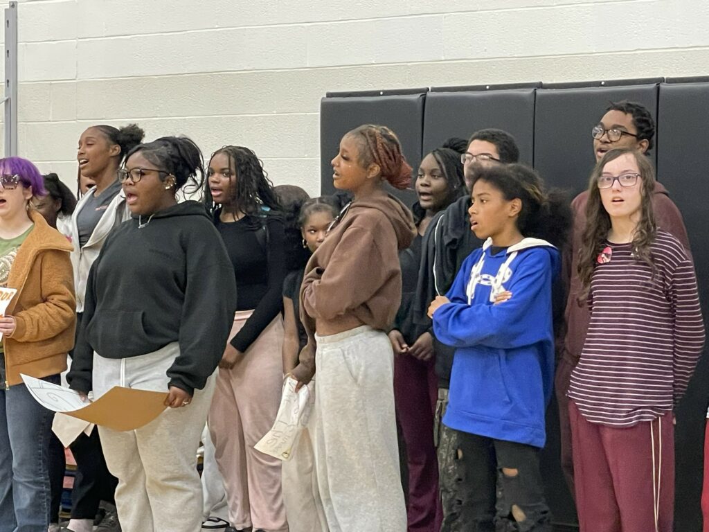 Jefferson students perform the National Anthem during the pep rally