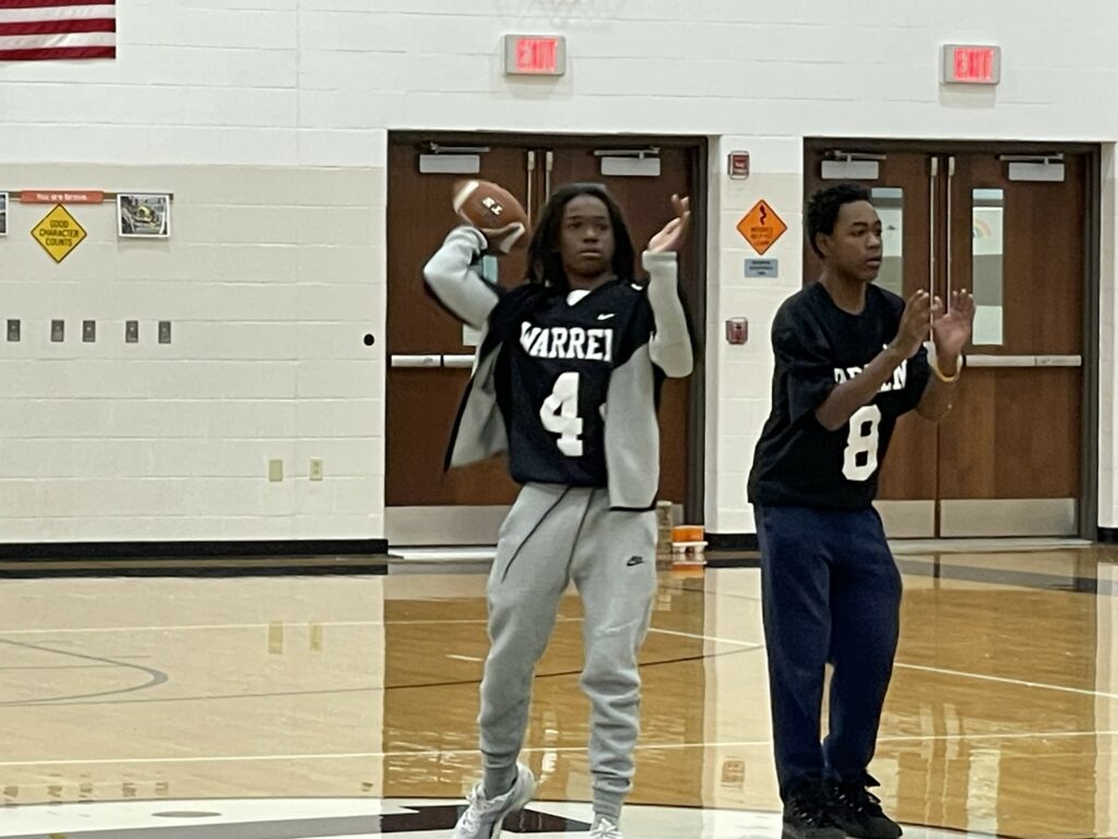 Jefferson football player trying to hit the target