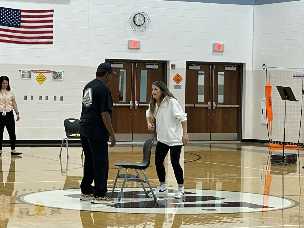 Coach Clark and Coach Hyde are the last two left in a game of musical chairs