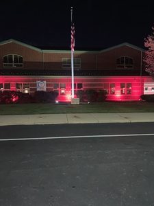 Lincoln school with red landscaping lights
