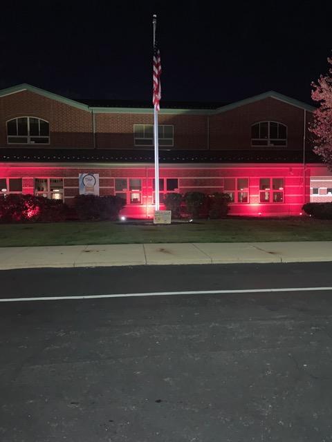 Lincoln school with red landscaping lights
