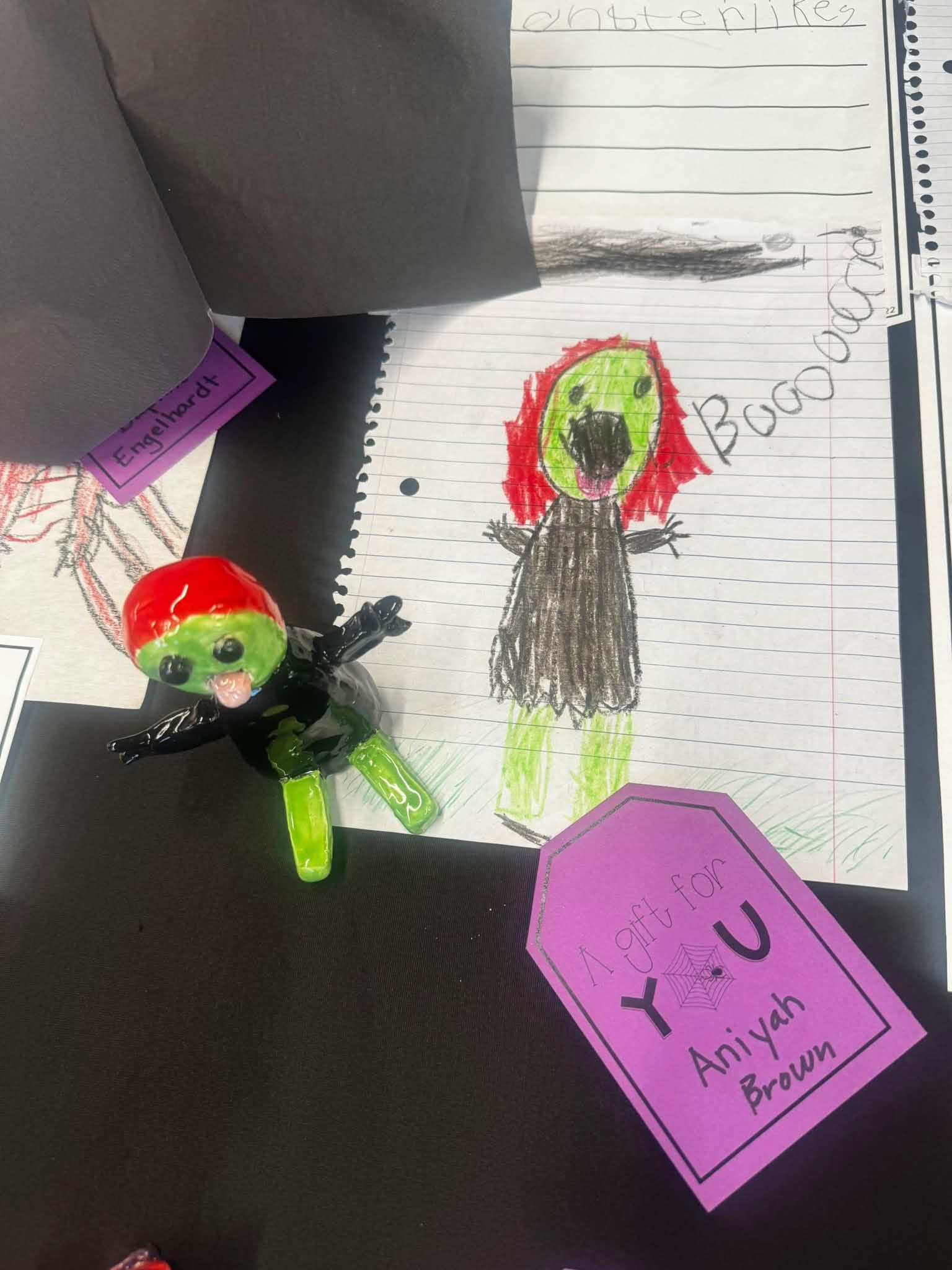green monster with red hear and a black dress